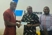 • Mr Gadegbeku (left) presenting the cheque to Mr Addai