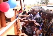 Rev. Isaac Owusu assisted by Mr  Louknaan Joseph and the chief and people inaugurating  the project. Photo: Paul Mwapouri
