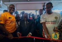 President Akufo-Addo (middle) cutting a tape to officially open the Borteman Sports Complex facility