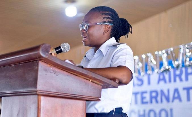 • Wing Commander Hilda Akuoko Adjei (inset) speaking to the pupils