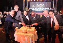 • President Akufo-Addo (third from right), Mr Maher Kheir (third from left) and other dignitaries cutting the anniversary cake