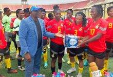 • Mr Nunoo Mensah presenting water to skipper Portia Boakye, while other members of the team look on
