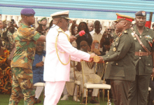 Vice Admiral Seth Amoama (left), the outgoing CDS handing over the symbol of authority to Maj. Gen. Thomas Oppong-Peprah at the farewell parade. Photo. Ebo Gorman