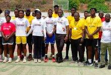 The Sports Minister (arrowed) in a pose with the national 3x3 basketball team