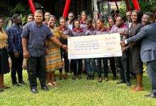 The beneficiaries receiving their cheques
