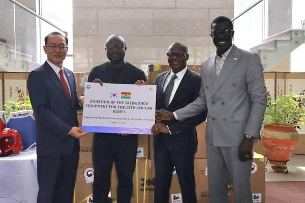 Amb. Kyongsig (left) presenting the items to Mr Otu (second right) while Mr Ndiye (right) and Mr Danso look on