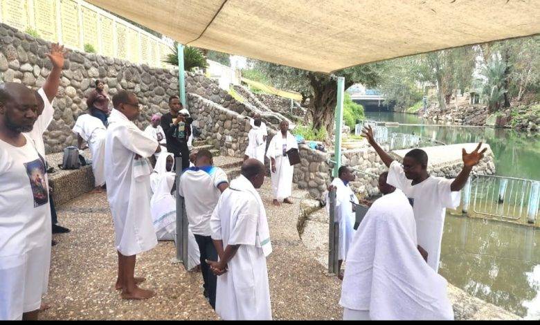Some Ghanaian pilgrims getting ready to be baptised in the Jordan River