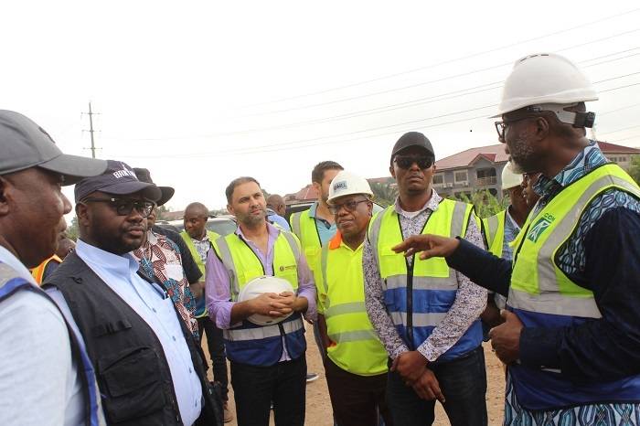 • Mr Asenso-Boakye (second from left) being briefed about the ongoing road project by Mr Kwabena Bempong (right) during his visit to the site Photo: Ebo Gorman