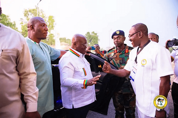 President Akufo-Addo (middle) being welcomed by Dr. Kweku Ofosu Asare during the closing ceremony of the 13th African games.