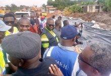 • Mr Francis Asenso-Boakye (middle) inspecting part of the road under construction