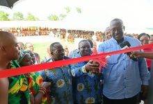 • Mr Atta-Mensah (right) and Mr Mortoti cutting the ribbon to commission the facility while Torgbe Nego VI (left) and others look on