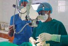 Eye specialist performing cataract surgery at Save the Nation's Sight Clinic