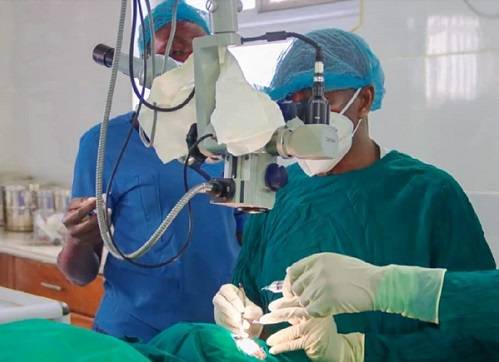 Eye specialist performing cataract surgery at Save the Nation's Sight Clinic