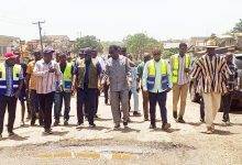 • Mr Asenso-Boakye (third from left), Mr Darko-Mensah (middle), Mr Rockson and others during the inspection of the depressions on the Kojokrom road