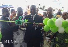 Mr Jinapor (3rd from left) cutting the ribbon to open the facility
