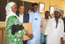 • Mr Alsattari (second from left) presenting items to one of the beneficiaries (left). With them include Sheikh Shiabu (third from right) and Mrs Deemah Alsattari, wife of the Ambassador (third from left)