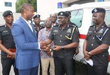 Dr Okoe Boye (left) presenting the keys to the ambulance to DCOP Samuel Otu-Nyarko