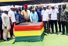 President Akufo-Addo (middle) pressing the nob to commission the solar plant