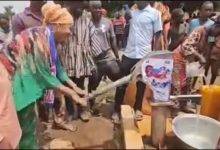 • Mrs Felecia Tettey trying her hands on the borehole machine