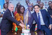 Ambassador Kheir (right)and other officials cutting cake to mark the day