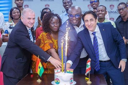 Ambassador Kheir (right)and other officials cutting cake to mark the day
