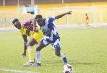 • Great Olympics’ Albert Amoah (right) in a tussle for the ball with Kobina Amoah of Medeama Photo: Raymond Ackumey