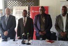 Mr Kilavoka (second left) with some officials of Kenya Airways