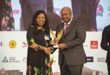 • Ms Obo-Nai receiving the award from Fmr. President, John Dramani Mahama