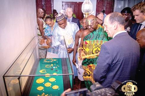 The Asantehene, Otumfuo Osei Tutu ll, and other officials admiring some of the items on display